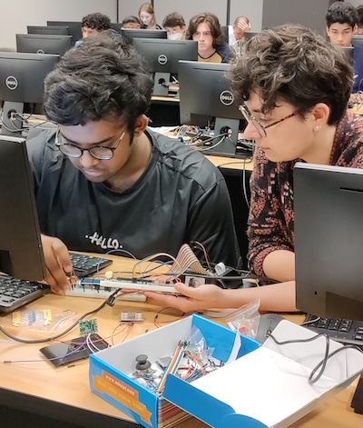 students working on circuits at desk